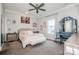 This main bedroom boasts a decorative vanity, neutral tones, and natural light at 13708 Huntson Park Ln, Huntersville, NC 28078
