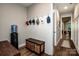 Functional mudroom with coat hooks, bench seating, and storage baskets for a tidy entryway at 13708 Huntson Park Ln, Huntersville, NC 28078
