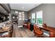 Spacious home office features beautiful wood desks, chairs, and natural light from the window at 13708 Huntson Park Ln, Huntersville, NC 28078