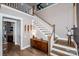 Stylish staircase with white railings, wooden steps, and designer touches create an appealing interior element at 13708 Huntson Park Ln, Huntersville, NC 28078