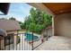 Gorgeous balcony view of the in-ground pool and lush landscaping at 1501 Alydar Ct, Waxhaw, NC 28173