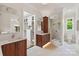 Luxurious bathroom featuring a double vanity, walk-in closet, and tiled walk-in shower at 1501 Alydar Ct, Waxhaw, NC 28173