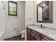 Elegant bathroom with granite counters, custom cabinets, and a window at 1501 Alydar Ct, Waxhaw, NC 28173