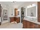 Bright, spacious bathroom with double vanity, modern lighting, and convenient washer and dryer at 1501 Alydar Ct, Waxhaw, NC 28173