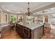 Gourmet kitchen with a large island, breakfast area, and seamless flow to the living space at 1501 Alydar Ct, Waxhaw, NC 28173