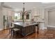 Beautiful kitchen with a large island, stainless steel appliances, and ample counter space at 1501 Alydar Ct, Waxhaw, NC 28173