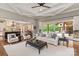 Bright living room with an open floor plan, hardwood floors, and seamless access to outdoor living at 1501 Alydar Ct, Waxhaw, NC 28173