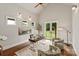 Bright home office with a modern desk, plush chairs, three windows, and access to the backyard through French doors at 1501 Alydar Ct, Waxhaw, NC 28173