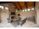 Stylish outdoor living area with a fireplace, TV, and kitchenette at 1501 Alydar Ct, Waxhaw, NC 28173