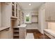Large walk-in closet with custom shelves, drawers, and window with natural light at 1501 Alydar Ct, Waxhaw, NC 28173