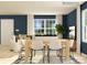 Open-concept living and dining area with white sofa and contemporary furnishings at 1515 River Cane St, Edgemoor, SC 29712