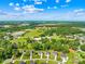 A peaceful community is shown in this aerial view filled with lush trees and skies at 1528 Avondale Dr, Statesville, NC 28625