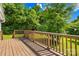 The wooden deck is ready for entertaining, overlooking a tree-filled yard at 1528 Avondale Dr, Statesville, NC 28625