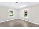 Comfortable bedroom featuring two windows providing natural light at 1528 Avondale Dr, Statesville, NC 28625