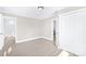 Bright bedroom showcasing closet and view to the kitchen and bathroom at 1528 Avondale Dr, Statesville, NC 28625