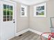 Inviting sunroom featuring bright windows and an access door to the outdoor deck at 1528 Avondale Dr, Statesville, NC 28625