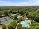 Community aerial view featuring tennis courts, a swimming pool, clubhouse and lush landscape at 1629 Southpoint Ln, New London, NC 28127