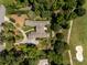 Aerial view of home on golf course, with lush landscaping at 1629 Southpoint Ln, New London, NC 28127