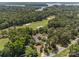 Aerial view of estate home on golf course with lake view at 1629 Southpoint Ln, New London, NC 28127