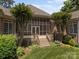 Elevated view of screened-in porch with deck and backyard at 1629 Southpoint Ln, New London, NC 28127