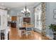 A dining room with ample natural light, complemented by elegant furnishings at 1629 Southpoint Ln, New London, NC 28127