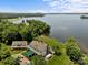 Stunning lakefront home with expansive lawn and beautiful landscaping at 1629 Southpoint Ln, New London, NC 28127