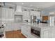 The open-concept kitchen includes a central island, custom cabinets, and stainless steel appliances at 1629 Southpoint Ln, New London, NC 28127