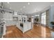 Expansive kitchen featuring custom cabinets, stainless steel appliances, and a granite island with seating at 1629 Southpoint Ln, New London, NC 28127