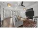 Open living room boasts hardwood floors, ample natural light, and a comfortable seating arrangement at 1629 Southpoint Ln, New London, NC 28127