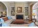 Comfortable living room featuring a fireplace and built-in bookshelves at 1629 Southpoint Ln, New London, NC 28127