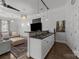 Inviting living area features a wet bar, plush seating, and stylish decor, perfect for entertaining at 1629 Southpoint Ln, New London, NC 28127