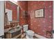 Chic powder room with antique vanity and wallpaper at 1629 Southpoint Ln, New London, NC 28127