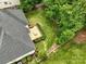 This aerial view displays the backyard featuring a deck, mature trees, and outdoor space for relaxing at 1653 Shetland Ln, Rock Hill, SC 29730