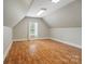 Spacious attic area with hardwood flooring, great for storage or as a bonus room at 1653 Shetland Ln, Rock Hill, SC 29730