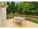 The wood deck includes a table with chairs, creating an inviting outdoor dining area and space to relax at 1653 Shetland Ln, Rock Hill, SC 29730