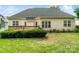 This backyard provides a private outdoor space with a wooden deck and a well maintained lawn at 1653 Shetland Ln, Rock Hill, SC 29730