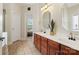 Bathroom featuring double sinks, cherry cabinets, and tile floor at 1653 Shetland Ln, Rock Hill, SC 29730