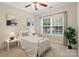 Cozy bedroom with a twin bed, complemented by serene decor and natural light from the window at 1653 Shetland Ln, Rock Hill, SC 29730