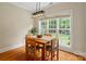 Bright dining area features hardwood floors and large window with backyard views at 1653 Shetland Ln, Rock Hill, SC 29730