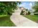 Charming home showcasing the landscaped front yard, curb appeal, and a two-car garage with a long driveway at 1653 Shetland Ln, Rock Hill, SC 29730
