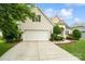 Charming home featuring a two-car garage, manicured landscaping, and a welcoming entrance at 1653 Shetland Ln, Rock Hill, SC 29730