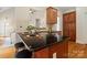 The kitchen has wood floors, cherry cabinets, and granite countertops at 1653 Shetland Ln, Rock Hill, SC 29730