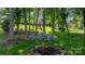 Backyard with fire pit and seating area, perfect for outdoor relaxation and entertaining at 179 Browning Dr, Taylorsville, NC 28681
