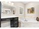 Elegant bathroom boasts a soaking tub, vanity area, and picture window at 179 Browning Dr, Taylorsville, NC 28681