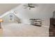 Spacious bonus room with a sloped ceiling, carpeted floor, and two ceiling fans at 179 Browning Dr, Taylorsville, NC 28681