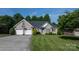 Well-maintained home with a two-car garage, landscaped front yard, and inviting curb appeal at 179 Browning Dr, Taylorsville, NC 28681