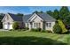 Charming brick home featuring manicured landscaping and a well-maintained lawn at 179 Browning Dr, Taylorsville, NC 28681