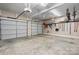 Spacious two car garage with ample storage space and convenient access to tools and equipment at 179 Browning Dr, Taylorsville, NC 28681