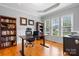 Cozy home office featuring hardwood floors, built-in shelving, and large windows at 179 Browning Dr, Taylorsville, NC 28681