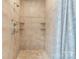 Tiled shower showcasing built-in shelves and stylish fixtures at 179 Browning Dr, Taylorsville, NC 28681